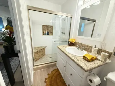 a white bathroom with a sink and a shower at Redondo Oceanfront Gem 2BR BA Balcony & Parking 335 in Redondo Beach