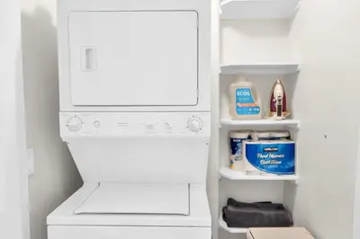 a white washer and dryer in a refrigerator at Lux Oasis in Woodland Hills in Los Angeles