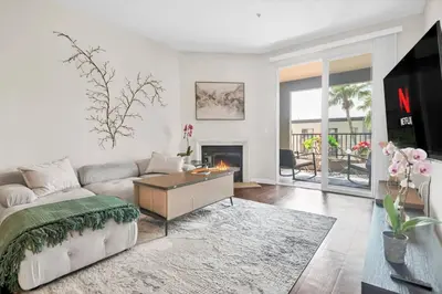 a living room with a couch and a fireplace at Lux Oasis in Woodland Hills in Los Angeles