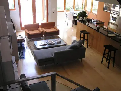 a living room with a couch and a table at Venice Canals Contemporary, unique wildlife, amazing reviews in Los Angeles