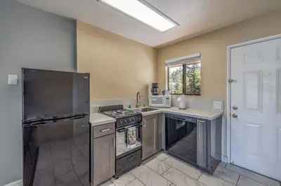 a kitchen with a stove and a counter top at Big Bear Lakefront Lodge in Big Bear Lake