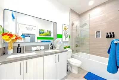a bathroom with a sink and a toilet and a shower at B- InstaWorthy & Family-Friendly NoHo Gem- Near Universal & Hollywood with Parking, Games, and Hot Tub in North Hollywood
