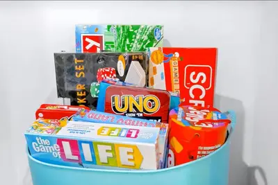 a basket filled with books and other toys at B- InstaWorthy & Family-Friendly NoHo Gem- Near Universal & Hollywood with Parking, Games, and Hot Tub in North Hollywood