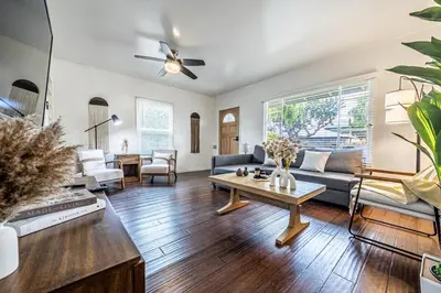 a living room with a couch and a table at 3BR Santa Monica Home, Ideal for Groups! in Los Angeles