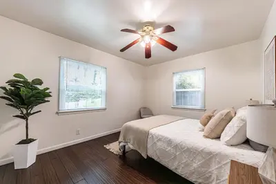 a bedroom with a ceiling fan and a bed at 3BR Santa Monica Home, Ideal for Groups! in Los Angeles