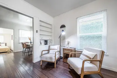 a living room with two chairs and a table at 3BR Santa Monica Home, Ideal for Groups! in Los Angeles
