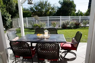 a table and chairs on a patio at Sensational 6 Bedroom 4 Bathroom Pool Home (3 Master Bedrooms W/bathrooms) in Anaheim