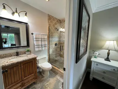 a bathroom with a shower and a toilet and a sink at Highly Upgraded, 5 Bed, 45 ba, New Pool w/Jacuzzi, 1/2 mile walk to Disney in Anaheim