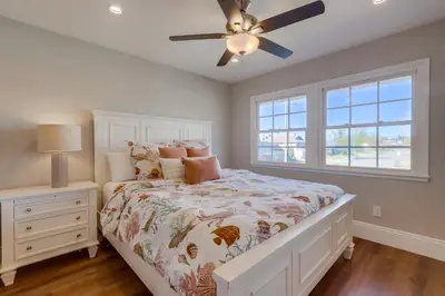 a bedroom with a bed and a ceiling fan at Gorgeous Upgraded 5 Bedroom & 3 Bath Home with pool in Orange