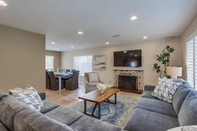 a living room with a couch and a fireplace at Beautiful Backyard Oasis 5 bedroom 3 Bathroom Home in Placentia