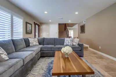 a living room with a couch and a coffee table at Beautiful Backyard Oasis 5 bedroom 3 Bathroom Home in Placentia
