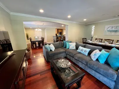 a living room with a couch and a table at Amazing Large Family Home w/Pool, 1 Mile to Disney in Anaheim