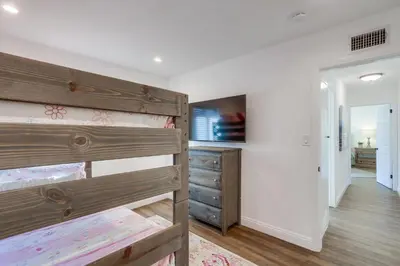 a bedroom with a bunk bed and a closet at Beautiful Remodel 3 Bedroom 2 bathroom Home with Pool & Jacuzzi in Fullerton