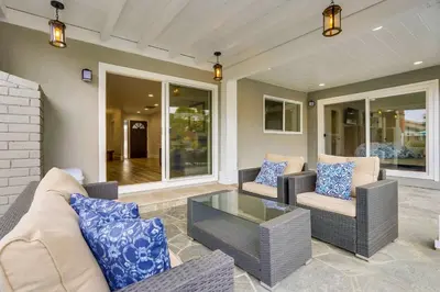 a living room with two couches and a glass table at Gorgeous Upgraded 5 Bedroom & 4 Bath Home with Jacuzzi in Orange