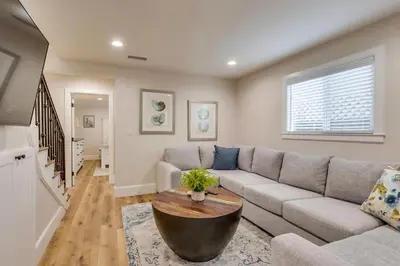 a living room with a couch and a table at Gorgeous Upgraded 5 Bedroom & 4 Bath Home with Jacuzzi in Orange