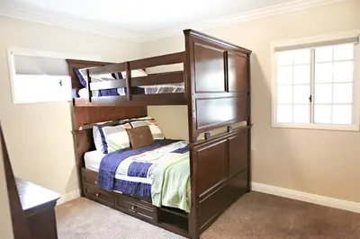 a bedroom with bunk beds and a bed at Wonderful 4 Bedroom 3 Bath Pool Home 3/4 Mile To Disney in Anaheim