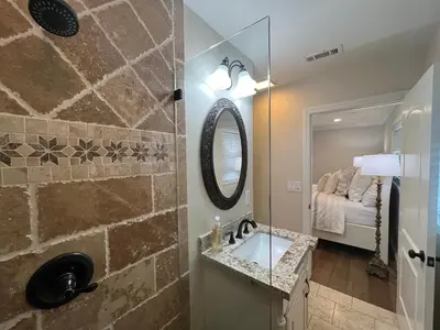 a bathroom with a sink and a mirror at Fantastic 6 bedroom, 45 bath home (4 master Suites), pool home in Anaheim