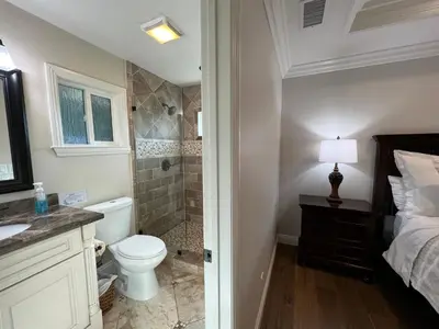 a bathroom with a toilet sink and a shower at Fantastic 6 bedroom, 45 bath home (4 master Suites), pool home in Anaheim