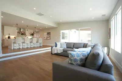 a living room with a couch and a dining room at 4 bedroom, 2 bathrooms in Orange