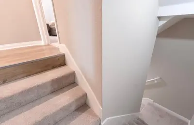 a staircase in a home with a white wall at Pacific Blue Townhome Walk to Ocean 2 Bed Apt WITH FREE PARKING in Los Angeles