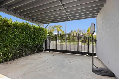a black gate with a tennis racket in front of it at Cozy Backhouse Stay – Sleeps 2 Beverly Hills Adj in Los Angeles