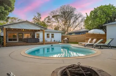 a swimming pool in the backyard of a house at Lake Balboa Hideaway in Los Angeles