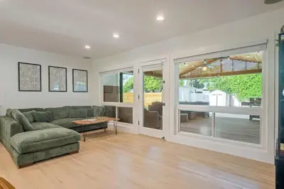 a living room with a couch and a table at Lake Balboa Hideaway in Los Angeles