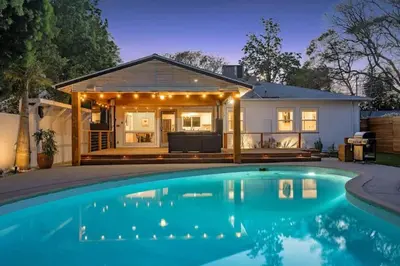 a house with a swimming pool in front of a house at Lake Balboa Hideaway in Los Angeles