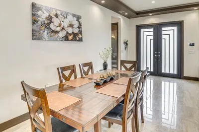 a dining room with a wooden table and chairs at Private Pool and Sauna Pet-Friendly Reseda Retreat! in Reseda