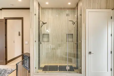 a shower in a bathroom with a glass door at Private Pool and Sauna Pet-Friendly Reseda Retreat! in Reseda