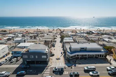 an aerial view of a parking lot next to the beach at 2BR Luxury Getaway Mins to Beach Arcade & Games in Manhattan Beach