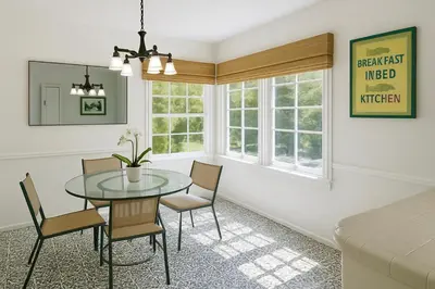 a dining room with a glass table and chairs at Enchanting Hollywood Hills Oasis with Tree-Top Views, Serene Outdoor Living Room, Zen Garden, Free Attached Garage, Sleeps 6, in LA's Most Desirable, Central, Serene Canyon Neighborhood, and Only 2 Minutes to Hollywood Boulevard in Los Angeles