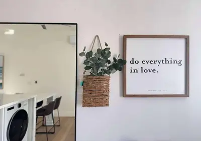 a picture of a plant on a wall with a picture at #Marbella Lane - Stylish Haven Near City Center in Long Beach