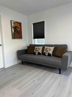 a living room with a couch in a room at Gated & Morden 1bed1bath house3367 in Baldwin Park