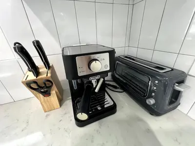 a kitchen counter with a microwave and a toaster oven at Gated & Morden 1bed1bath house3367 in Baldwin Park
