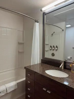 a bathroom with a sink and a tub and a mirror at Elegant Suite at Marina-Venice Beach with Pool, Jacuzzi, GYM by Holisticā Retreats in Los Angeles