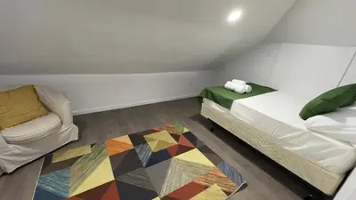a small room with a bed and a couch at Naryn Guest house in Los Angeles