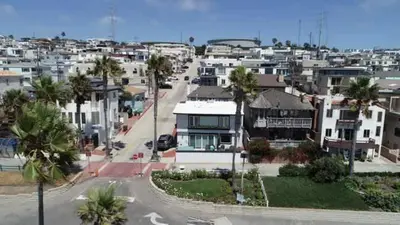 an aerial view of a city with houses and palm trees at Manhattan Beach Beachfront Charming On The Strand in Manhattan Beach