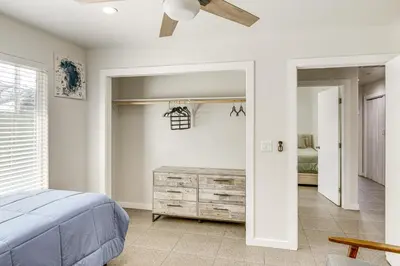 a bedroom with a bed and a ceiling fan at 1 Mi to Rabobank Arena Home with Gazebo! in Bakersfield