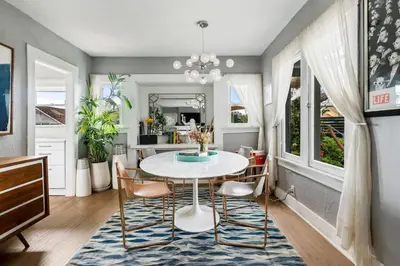 a dining room with a table and chairs at Bougainvillea Bungalow Peaceful Venice Retreat in Los Angeles