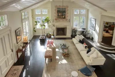 a living room with a couch and a fireplace at Laurel Canyon Classic Hollywood Residence With Pool in Los Angeles