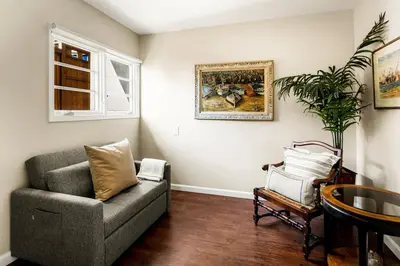 a living room with a couch and a chair at New Listing The Nautilus Manhattan Beachfront Retreat in Manhattan Beach