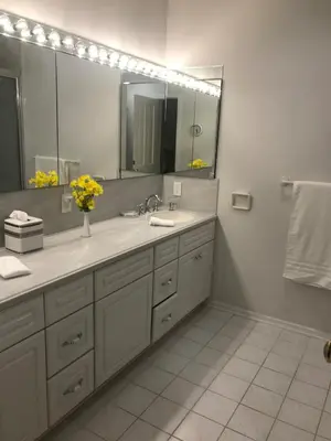 a bathroom with a sink and a large mirror at Bella Villa near Beverly Hills Amazing City view and hot tub in Los Angeles