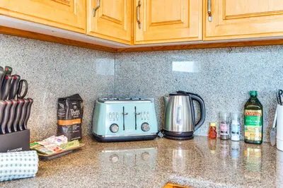 a kitchen counter with a toaster on a counter top at Steps to Ocean Manhattan Beach Gem with Deck! in Manhattan Beach