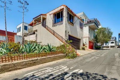 a house on the side of a street at Steps to Ocean Manhattan Beach Gem with Deck! in Manhattan Beach