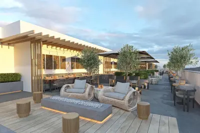 a patio with couches and tables and chairs at Hilton Arcadia Los Angeles in Arcadia