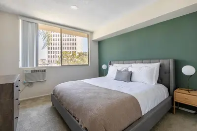 a bedroom with a large bed and a window at Brentwood 2BR w Outdoor Pool nr shops LAX-146 in Los Angeles