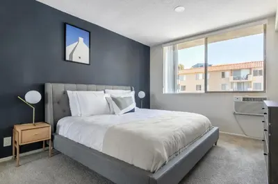 a bedroom with a large bed and a window at Brentwood 2BR w Outdoor Pool nr shops LAX-146 in Los Angeles