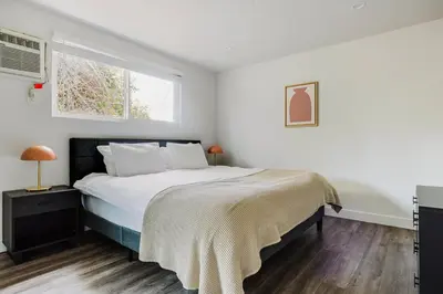 a bedroom with a large bed and a window at Blueground Mar Vista nr Venice Beach wd LAX-1327 in Los Angeles