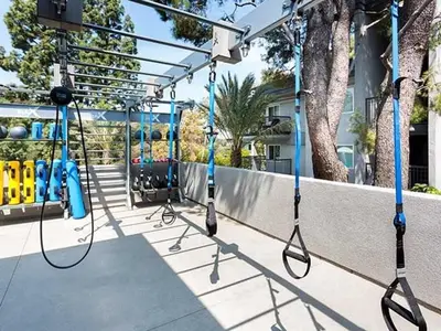 a group of swings on a playground at Blueground Burbank pool bbq nr studios LAX-1321 in Los Angeles